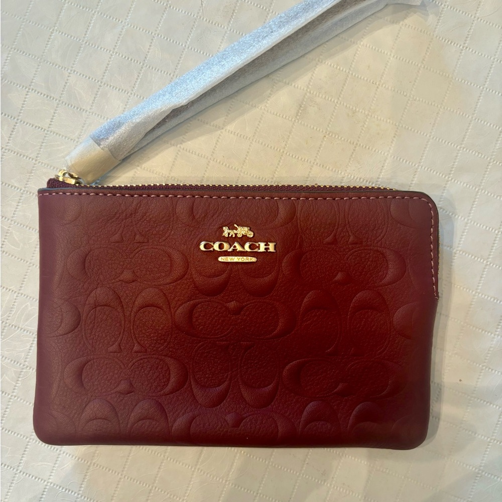 CLOSET CLEARANCE Coach Maroon Embossed Leather Wristlet NWT
Make an offer!
